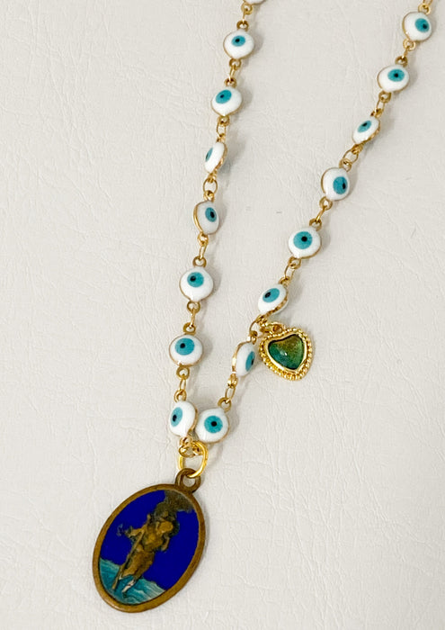 Collar con dije de santo vintage con ojos malvados